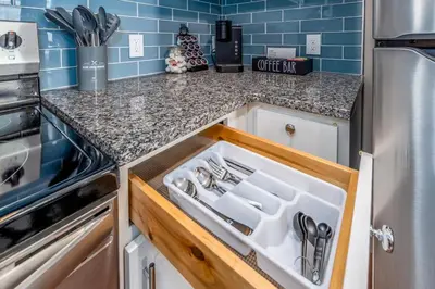 a kitchen with a white sink in a drawer at OTR 2 Lux Queen Beds Sleeps 5ppl Light Rail Wifi in Cincinnati