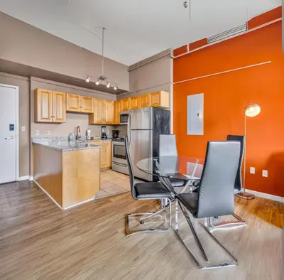 a kitchen with a table and chairs in a room at 1Br in Heart of Downtown, Sauna, Prime Location in Cleveland
