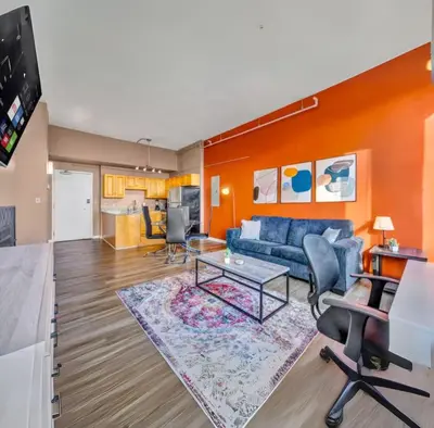 a living room with a couch and a table at 1Br in Heart of Downtown, Sauna, Prime Location in Cleveland