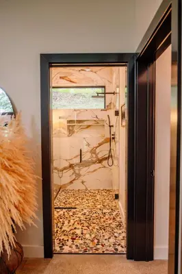 a glass door with a painting on the wall at Native Legacy in Loudonville
