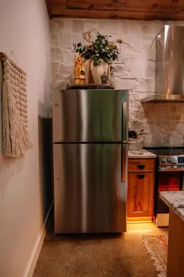 a stainless steel refrigerator in a kitchen at Lotus in Loudonville