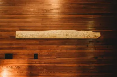 a wooden wall with a sign on it at Corton Lodge on the Elk River - Riverview Suite