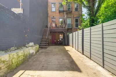 an alley with a stairway leading to a building at Cincy Apt 1 Mi to Findlay Market, 2 Mi to Downtown in Cincinnati