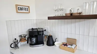a kitchen counter with a coffee maker on a counter top at The Mysa - Couples Retreat, Luxe, Sauna, Hot tub in Rockbridge