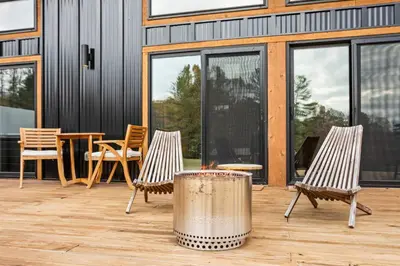 two chairs and a table on a patio at The Mysa - Couples Retreat, Luxe, Sauna, Hot tub in Rockbridge