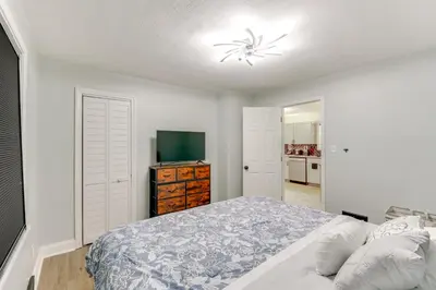 a bedroom with a bed and a television in it at 3 Mi to Dtwn Youngstown and YSU Family Home with Yard in Youngstown