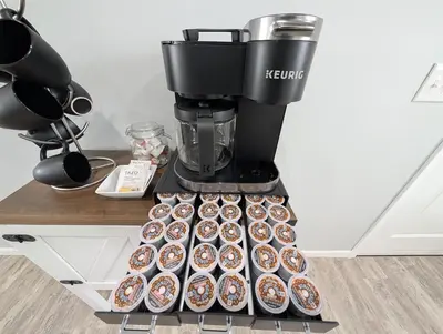 a coffee maker with a bunch of donuts on a counter at Relaxing River View Stay Renovated 3BR Home in Fremont