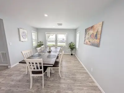 a dining room with a table and chairs at Relaxing River View Stay Renovated 3BR Home in Fremont