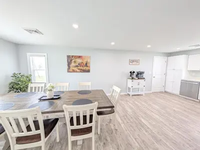 a kitchen and dining room with a table and chairs at Relaxing River View Stay Renovated 3BR Home in Fremont