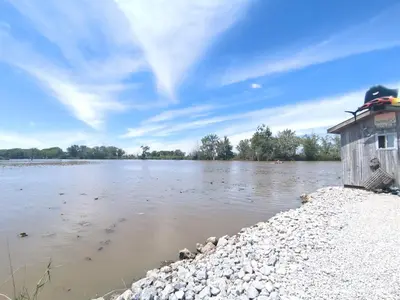 a small shack on the shore of a river at Country Charm on the Sandusky Live Music Nearby in Fremont