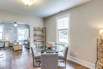 a dining room with a glass table and chairs at 1 Mi to Water and Dtwn Lake Erie Family Getaway in Sandusky