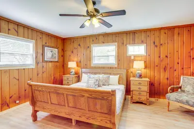 a bedroom with a bed and a ceiling fan at 1 Mi to Water and Dtwn Lake Erie Family Getaway in Sandusky