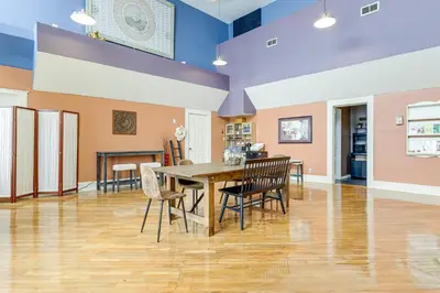 a dining room with a wooden table and chairs at Downtown Apt 23 Mi to Hocking Hills State Park in Lancaster