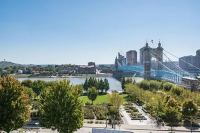 a view of a bridge over a river with a city at CozySuites - Current at the Banks in Cincinnati