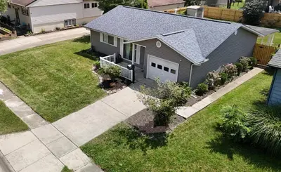 an aerial view of a house with a driveway at Private Home - Entire House - Ranch - Hot Tub - Pets Welcome - 2 King Beds - Kids Welcome - Fenced Yard - Free Wifi - Quiet Neighborhood in Columbus