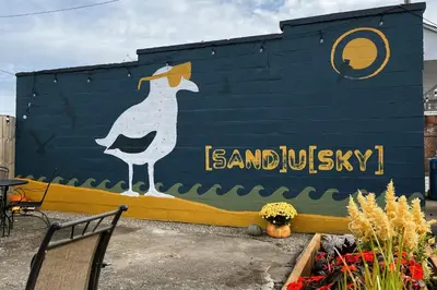 a mural of a bird painted on the side of a building at Fiesinger House - Private 1-bd unit, Historic Home Downtown Sandusky in Sandusky