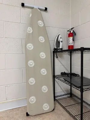 a surfboard hanging on a rack next to a wall at Bridgeport House WV, Close to UHC, FBI, The Bridge Complex in Bridgeport