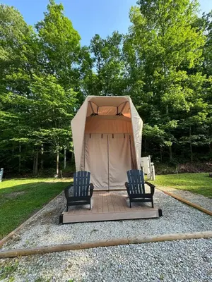 two chairs sitting in front of a tent at Safari Tent Glamping in Kentucky with AC and Access to Biking Trails in Grayson
