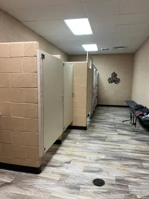 a row of lockers in a room with a hallway at Safari Tent Glamping in Kentucky with AC and Access to Biking Trails in Grayson