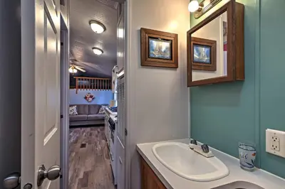 a bathroom with a sink and a mirror at Resort Cabin 1 Mi to Middle Bass Island State Park in Middle Bass