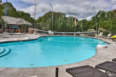 a large swimming pool with chairs in a resort at Resort Cabin 1 Mi to Middle Bass Island State Park in Middle Bass