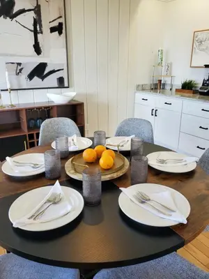 a table with plates and utensils and oranges on it at Luxe Mt Adams Lookout in Cincinnati