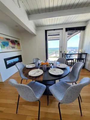 a dining room with a table and chairs at Luxe Mt Adams Lookout in Cincinnati