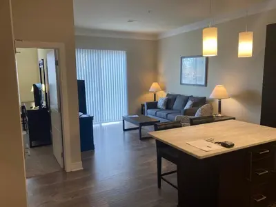 a living room with a couch and a table at Beautiful in Beachwood in Beachwood