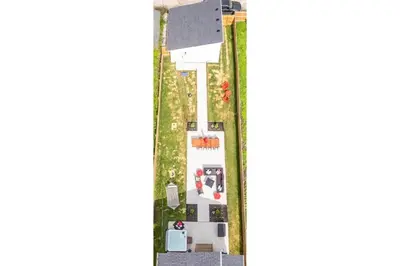 a floor plan of a house with a yard at Hot Tub - Mins to Short North - Retro Game Room in Columbus