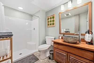 a bathroom with a sink and a toilet at Studio at Superior l Downtown l Parking l Café in Cleveland