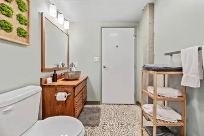 a bathroom with a sink and a toilet at Studio at Superior l Downtown l Parking l Café in Cleveland