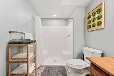 a bathroom with a shower and a toilet at Studio at Superior l Downtown l Parking l Café in Cleveland