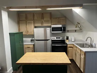a kitchen with a white refrigerator and a sink at Apartment in Newark in Newark