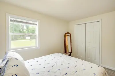 a bedroom with a bed and a window at Grand Lake Getaway with Boat Dock in St Marys!
