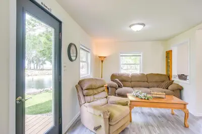 a living room with a couch and a table at Grand Lake Getaway with Boat Dock in St Marys!