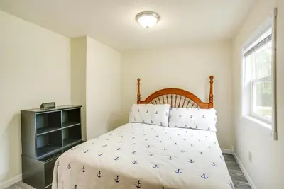 a bedroom with a bed and a window at Grand Lake Getaway with Boat Dock in St Marys!