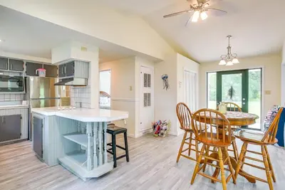 a kitchen and dining room with a table and chairs at Grand Lake Getaway with Boat Dock in St Marys!