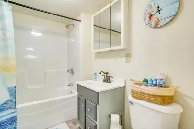 a bathroom with a toilet and a sink and a shower at Boat Dock Couples Grand Lake Getaway!