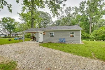 a small house with a gravel driveway at Boat Dock Couples Grand Lake Getaway!