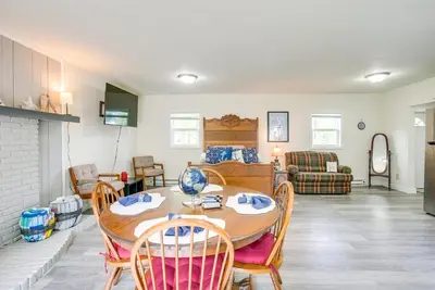 a living room with a table and chairs at Boat Dock Couples Grand Lake Getaway!