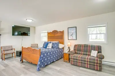 a bedroom with a bed and a couch and a chair at Boat Dock Couples Grand Lake Getaway!