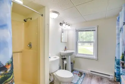 a bathroom with a toilet and a sink at Grand Lake Cabin with Private Dock in St Marys!