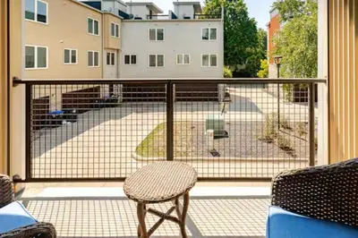 a balcony with a view of a dog at The Penny Lane Suite in Akron