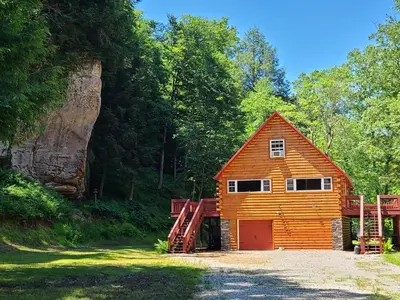 a cabin in the middle of a forest at A Birds Eye View Cabin Rentals in Logan