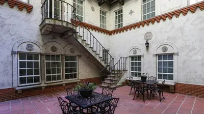 a patio with tables and chairs and a staircase at Landing Chic 1BD Clubhouse Gym in Dayton