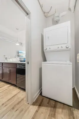 a kitchen with a white stove and a refrigerator at Spacious DT Condo l Free Parking l Fast Wi-Fi in Cleveland