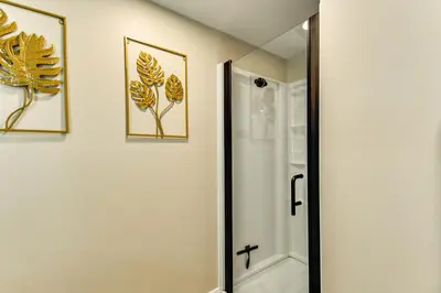 a bathroom with a shower and a mirror at BBQ Ready Retreat on Rice Near Licking River