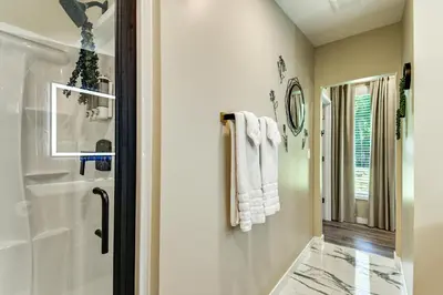 a bathroom with a shower and a sink at BBQ Ready Retreat on Rice Near Licking River