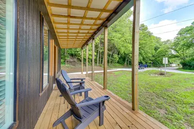 two chairs sitting on a porch of a house at BBQ Ready Retreat on Rice Near Licking River