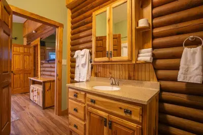 a bathroom with a sink and a mirror at Diamond Creek | Sleeps up to 6 in Gallipolis